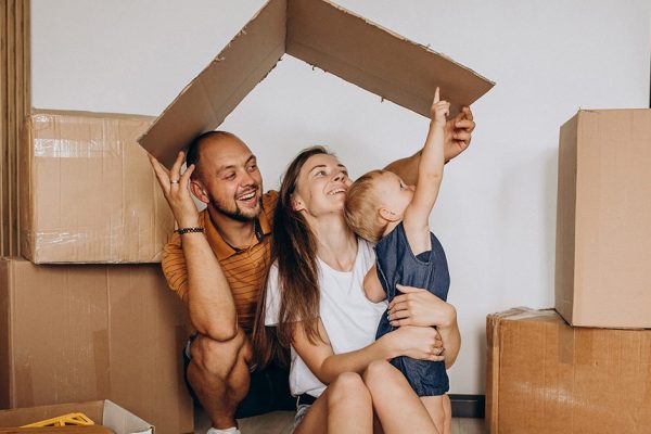 Young family with little daughter moving into new house