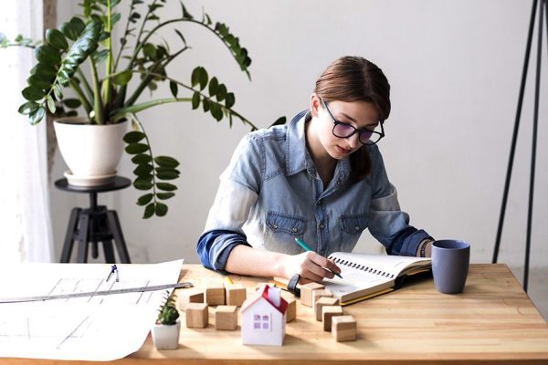 an-overhead-view-of-female-real-estate-agent-working-in-office