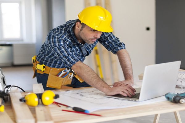 Portrait of hard working building contractor