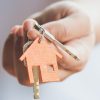 Female,Hand,Holding,House,Key,real,Estate,Agent.