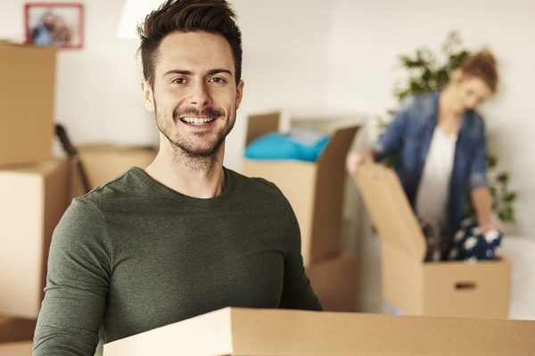 Man carrying box for new house