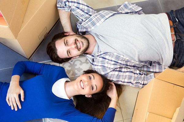 Young couple moving in new home