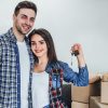 Happy couple with keys from new apartaments!