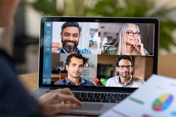 Woman working from home through video conference